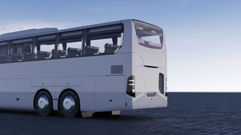 Modern white coach bus ready for airport transfer Budapest stag, offering spacious and comfortable travel for large groups